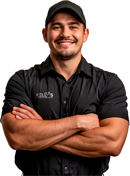 Smiling man in a black cap and black short-sleeve shirt with “KELLY’S” logo, standing with arms crossed against a white background—ready to tackle any new construction plumbing challenge with expertise and confidence.